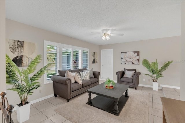 8134 Hook Cir, Orlando, FL 32836 - living room featuring light tile patterned floors, a ceiling fan, baseboards, and a textured ceiling