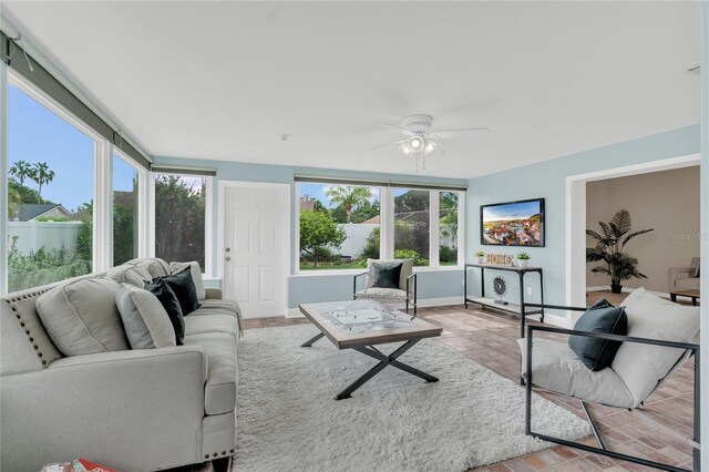 8134 Hook Cir, Orlando, FL 32836 - living area featuring healthy amount of natural light, a ceiling fan, baseboards, and light wood-type flooring