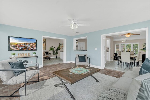 8134 Hook Cir, Orlando, FL 32836 - tiled living area with a ceiling fan and baseboards
