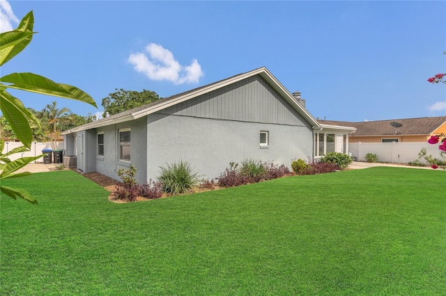 8134 Hook Cir, Orlando, FL 32836 - view of side of property featuring a chimney, stucco siding, and a patio area