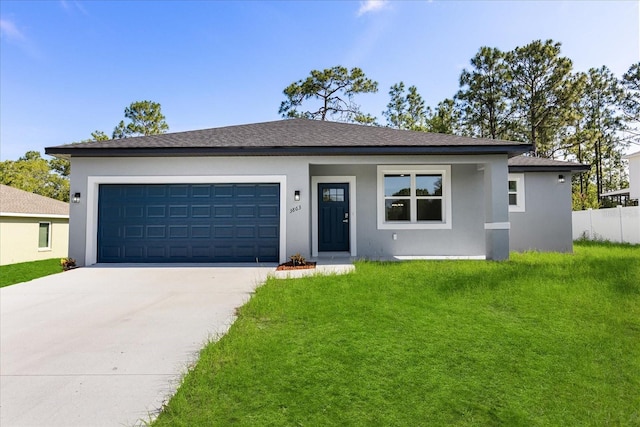 3863 W Galleon St, Dunnellon, FL 34433 - view of front of house featuring concrete driveway, an attached garage, stucco siding, and roof with shingles