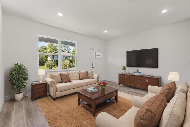 3863 W Galleon St, Dunnellon, FL 34433 - living area with light wood-type flooring, recessed lighting, and baseboards