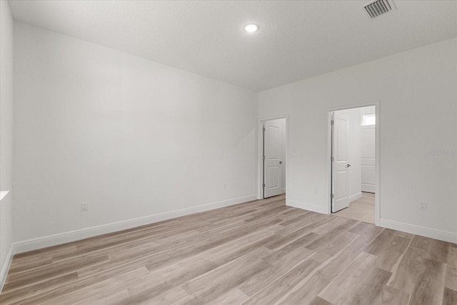 3863 W Galleon St, Dunnellon, FL 34433 - empty room featuring light wood finished floors, baseboards, and recessed lighting