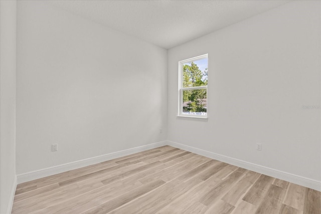 3863 W Galleon St, Dunnellon, FL 34433 - spare room with light wood-style floors and baseboards