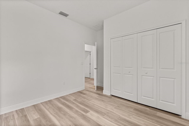 3863 W Galleon St, Dunnellon, FL 34433 - unfurnished bedroom with light wood-style floors, a closet, and baseboards