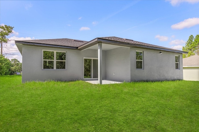 3863 W Galleon St, Dunnellon, FL 34433 - rear view of house with stucco siding, a patio area, and a lawn
