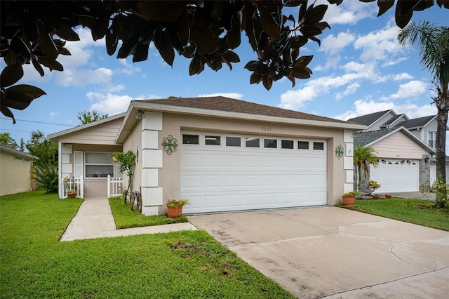 3033 Dunhill Dr, Cocoa, FL 32926 - view of front of property featuring stucco siding, a front yard, and a garage