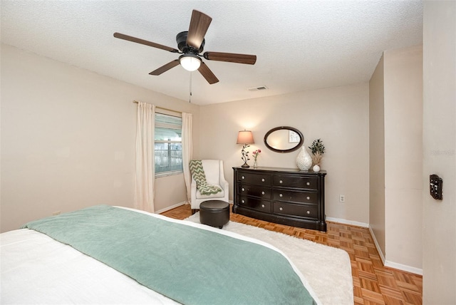3033 Dunhill Dr, Cocoa, FL 32926 - bedroom featuring baseboards, a textured ceiling, and a ceiling fan