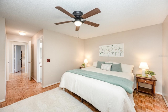 3033 Dunhill Dr, Cocoa, FL 32926 - bedroom with baseboards, a ceiling fan, and a textured ceiling