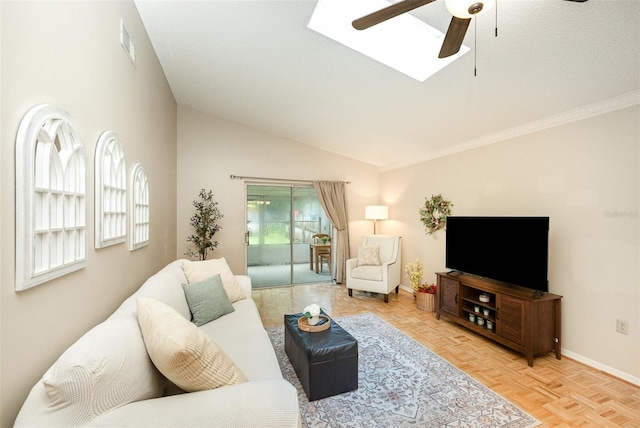 3033 Dunhill Dr, Cocoa, FL 32926 - living area featuring a ceiling fan, lofted ceiling, baseboards, and a skylight