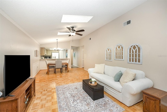 3033 Dunhill Dr, Cocoa, FL 32926 - living room featuring vaulted ceiling, a chandelier, a skylight, and ceiling fan