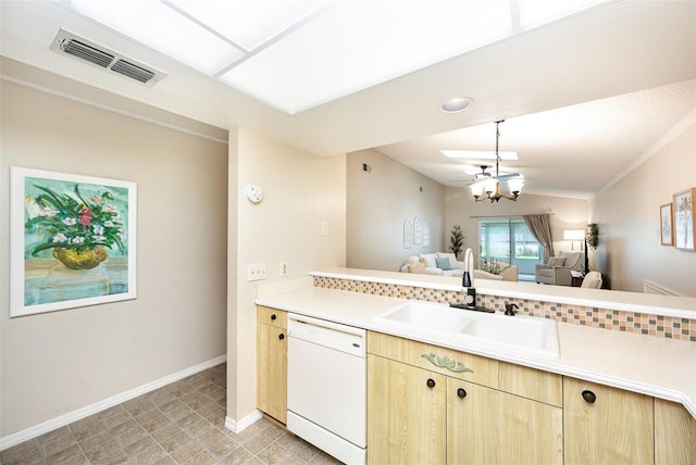 3033 Dunhill Dr, Cocoa, FL 32926 - kitchen with white dishwasher, a sink, light brown cabinetry, light countertops, and open floor plan