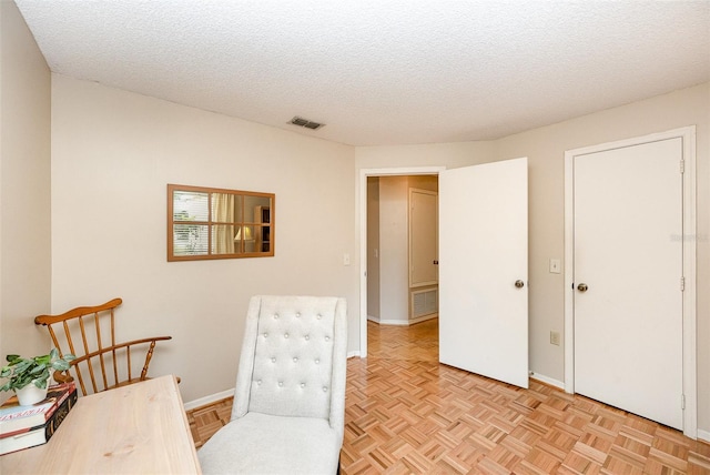 3033 Dunhill Dr, Cocoa, FL 32926 - sitting room with a textured ceiling and baseboards