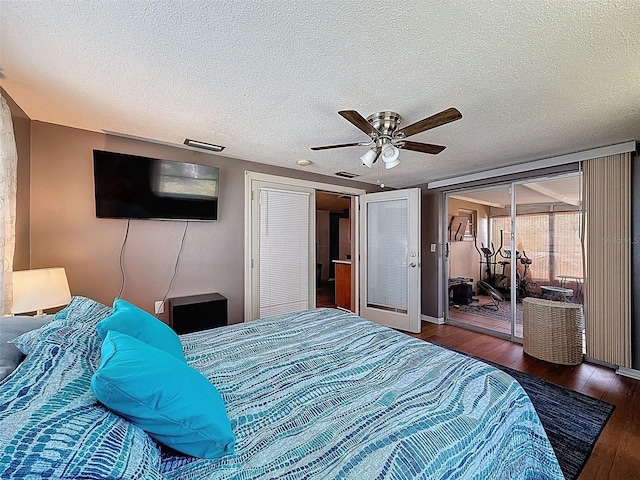 5415 Riddle Rd, Holiday, FL 34690 - bedroom featuring wood finished floors, a textured ceiling, a ceiling fan, and access to outside