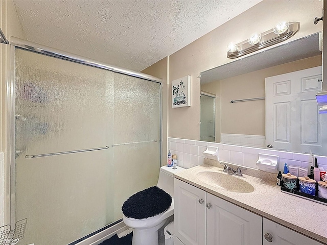 5415 Riddle Rd, Holiday, FL 34690 - full bath featuring a textured ceiling, toilet, a shower stall, and vanity