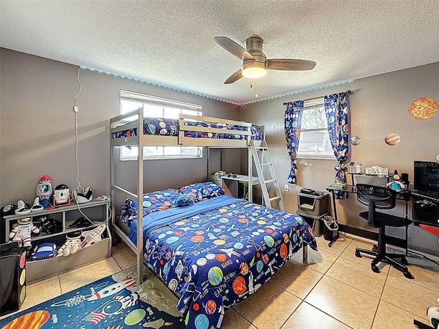 5415 Riddle Rd, Holiday, FL 34690 - tiled bedroom featuring a textured ceiling and ceiling fan