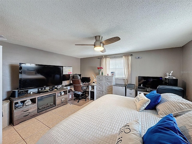 5415 Riddle Rd, Holiday, FL 34690 - bedroom with an office area, light tile patterned flooring, ceiling fan, and a textured ceiling