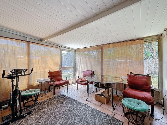 5415 Riddle Rd, Holiday, FL 34690 - sunroom with plenty of natural light, tile patterned floors, expansive windows, and outdoor dining area