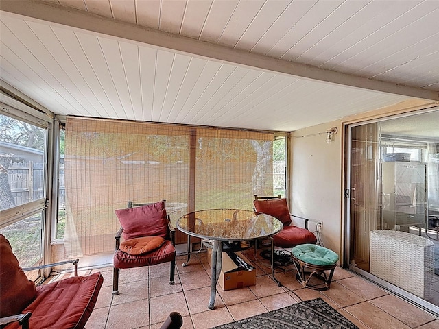 5415 Riddle Rd, Holiday, FL 34690 - sunroom / solarium featuring outdoor dining space and beamed ceiling