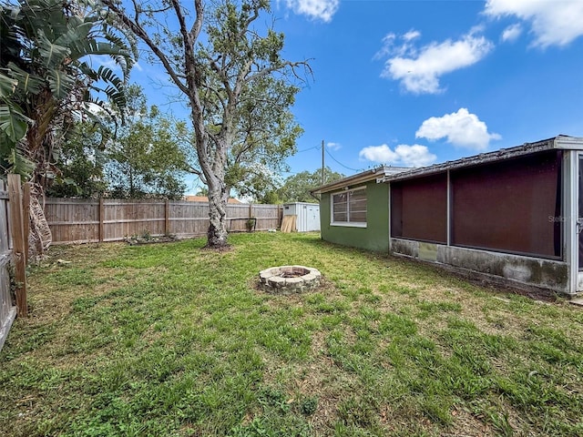 5415 Riddle Rd, Holiday, FL 34690 - view of yard featuring a fire pit
