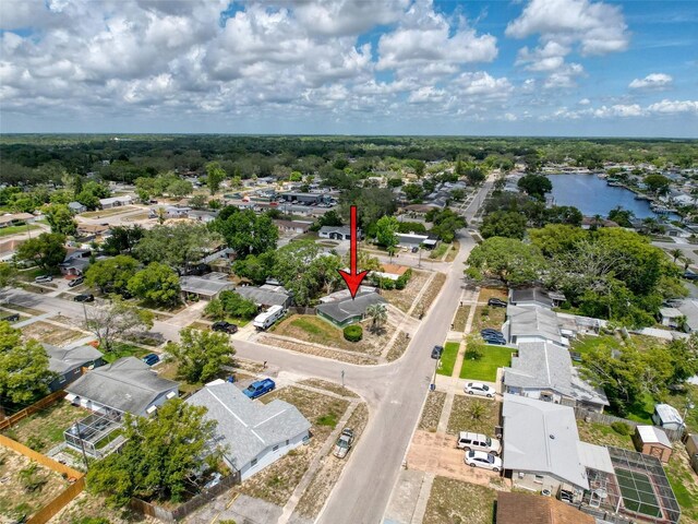 5415 Riddle Rd, Holiday, FL 34690 - aerial perspective of suburban area featuring a large body of water