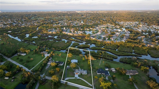 775 Bay Dr, New Smyrna Beach, FL 32168 - aerial view of property and surrounding area featuring a large body of water and nearby suburban area