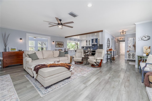 775 Bay Dr, New Smyrna Beach, FL 32168 - living area featuring ornamental molding, a ceiling fan, wood finished floors, recessed lighting, and baseboards