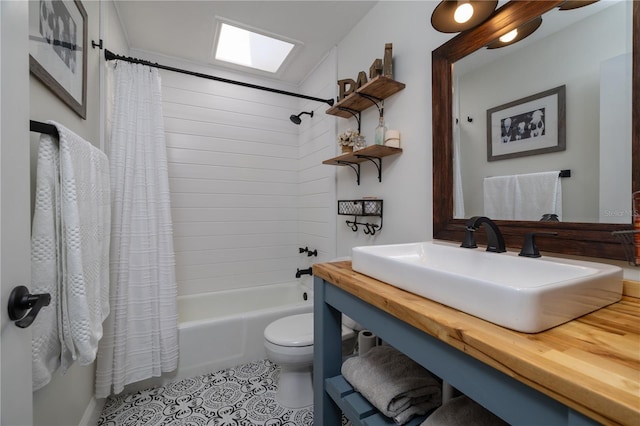 775 Bay Dr, New Smyrna Beach, FL 32168 - full bath with toilet, shower / bath combination with curtain, vanity, and tile patterned floors