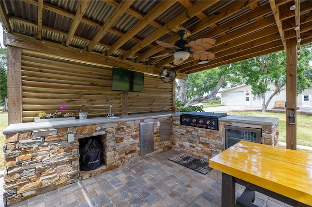 775 Bay Dr, New Smyrna Beach, FL 32168 - view of patio featuring ceiling fan, beverage cooler, and a sink