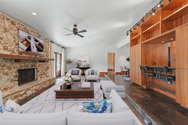 6327 Ridgeberry Dr, Orlando, FL 32819 - living room featuring ceiling fan, a fireplace, recessed lighting, and concrete floors