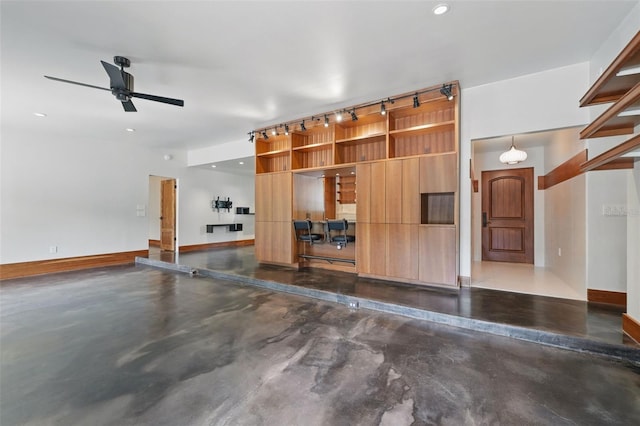 6327 Ridgeberry Dr, Orlando, FL 32819 - garage featuring ceiling fan and recessed lighting