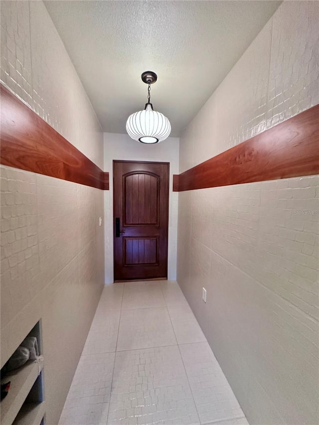 6327 Ridgeberry Dr, Orlando, FL 32819 - hallway featuring tile patterned flooring