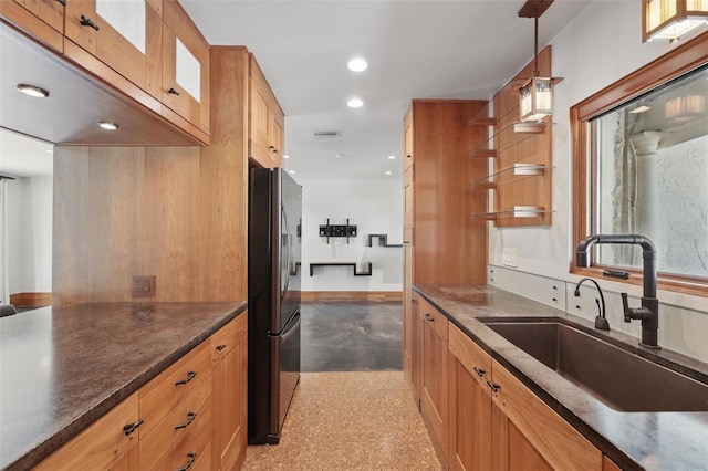 6327 Ridgeberry Dr, Orlando, FL 32819 - kitchen featuring freestanding refrigerator, recessed lighting, hanging light fixtures, dark stone counters, and open shelves