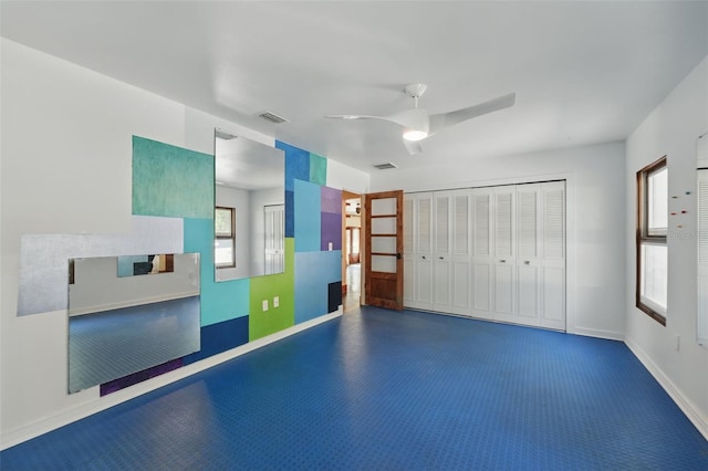 6327 Ridgeberry Dr, Orlando, FL 32819 - unfurnished bedroom with a ceiling fan and baseboards