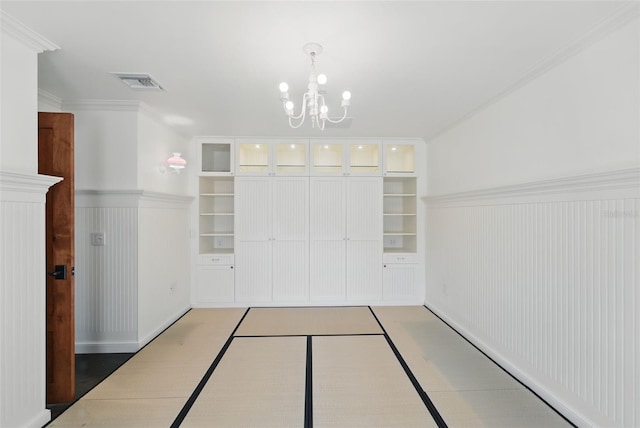 6327 Ridgeberry Dr, Orlando, FL 32819 - view of community featuring a chandelier and a wainscoted wall