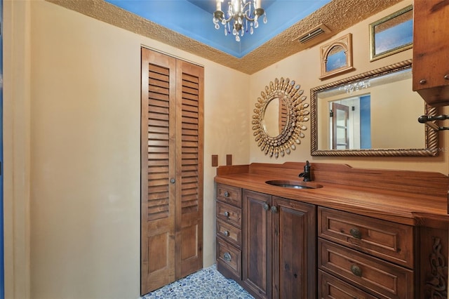 6327 Ridgeberry Dr, Orlando, FL 32819 - bathroom featuring vanity and a chandelier