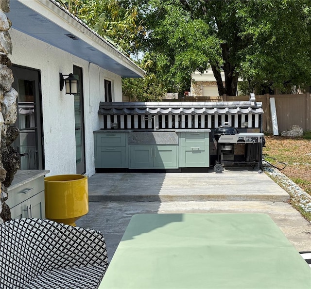6327 Ridgeberry Dr, Orlando, FL 32819 - view of patio featuring an outdoor kitchen