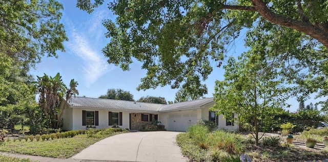 6327 Ridgeberry Dr, Orlando, FL 32819 - single story home with a garage, driveway, and stucco siding