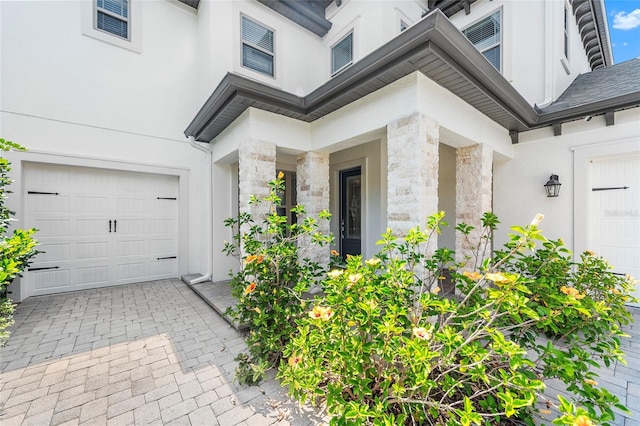 808 Sherbourne Cir, Lake Mary, FL 32746 - entrance to property with stone siding, a garage, and stucco siding