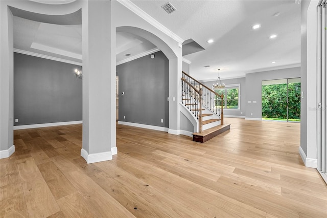808 Sherbourne Cir, Lake Mary, FL 32746 - entryway with a chandelier, crown molding, stairway, baseboards, and light wood finished floors