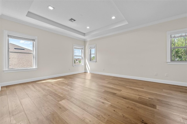 808 Sherbourne Cir, Lake Mary, FL 32746 - spare room with a raised ceiling, light wood finished floors, ornamental molding, baseboards, and recessed lighting