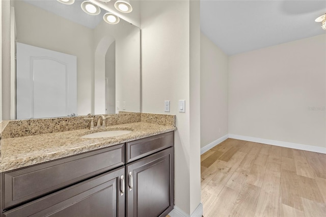 808 Sherbourne Cir, Lake Mary, FL 32746 - bathroom featuring wood finished floors, vanity, and baseboards