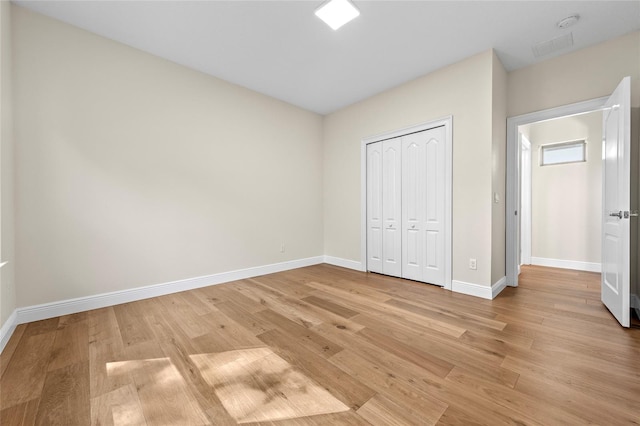 808 Sherbourne Cir, Lake Mary, FL 32746 - unfurnished bedroom featuring light wood-type flooring, baseboards, and a closet