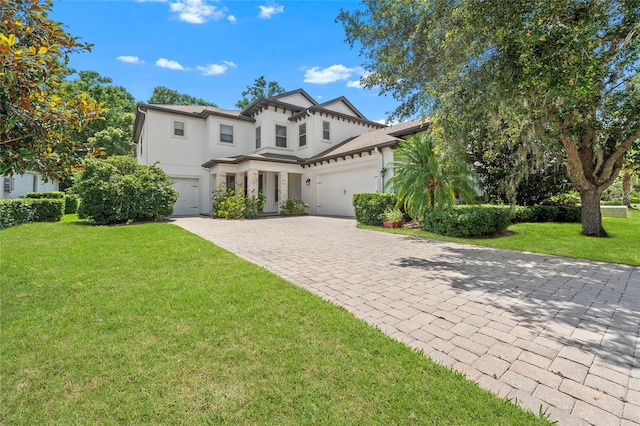 808 Sherbourne Cir, Lake Mary, FL 32746 - view of front of property with stucco siding, decorative driveway, a front yard, and an attached garage