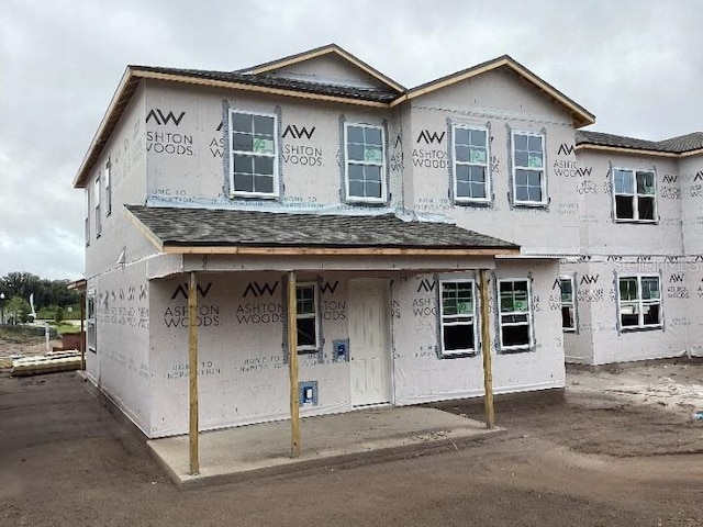 2371 Zuni Rd, Saint Cloud, FL 34771 - unfinished property with stucco siding and a shingled roof