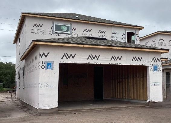 2371 Zuni Rd, Saint Cloud, FL 34771 - view of building exterior featuring a garage