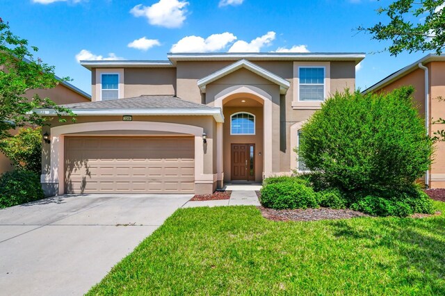 2209 Crofton Ave, Davenport, FL 33837 - traditional-style home featuring stucco siding, concrete driveway, an attached garage, and a front lawn