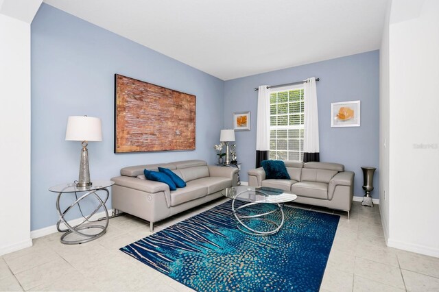 2209 Crofton Ave, Davenport, FL 33837 - living area with light tile patterned floors and baseboards