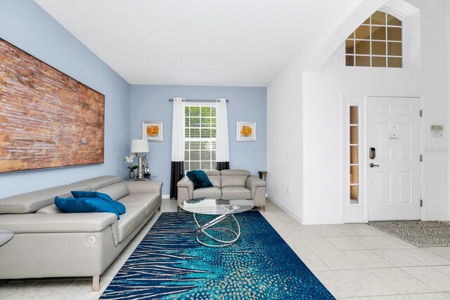 2209 Crofton Ave, Davenport, FL 33837 - living area featuring light tile patterned flooring and baseboards