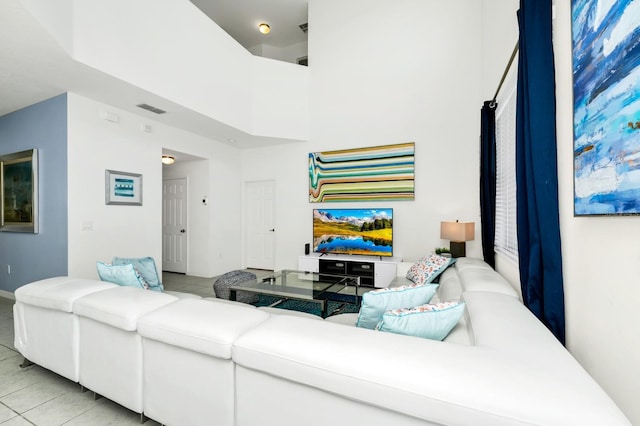 2209 Crofton Ave, Davenport, FL 33837 - living area with light tile patterned floors and a high ceiling